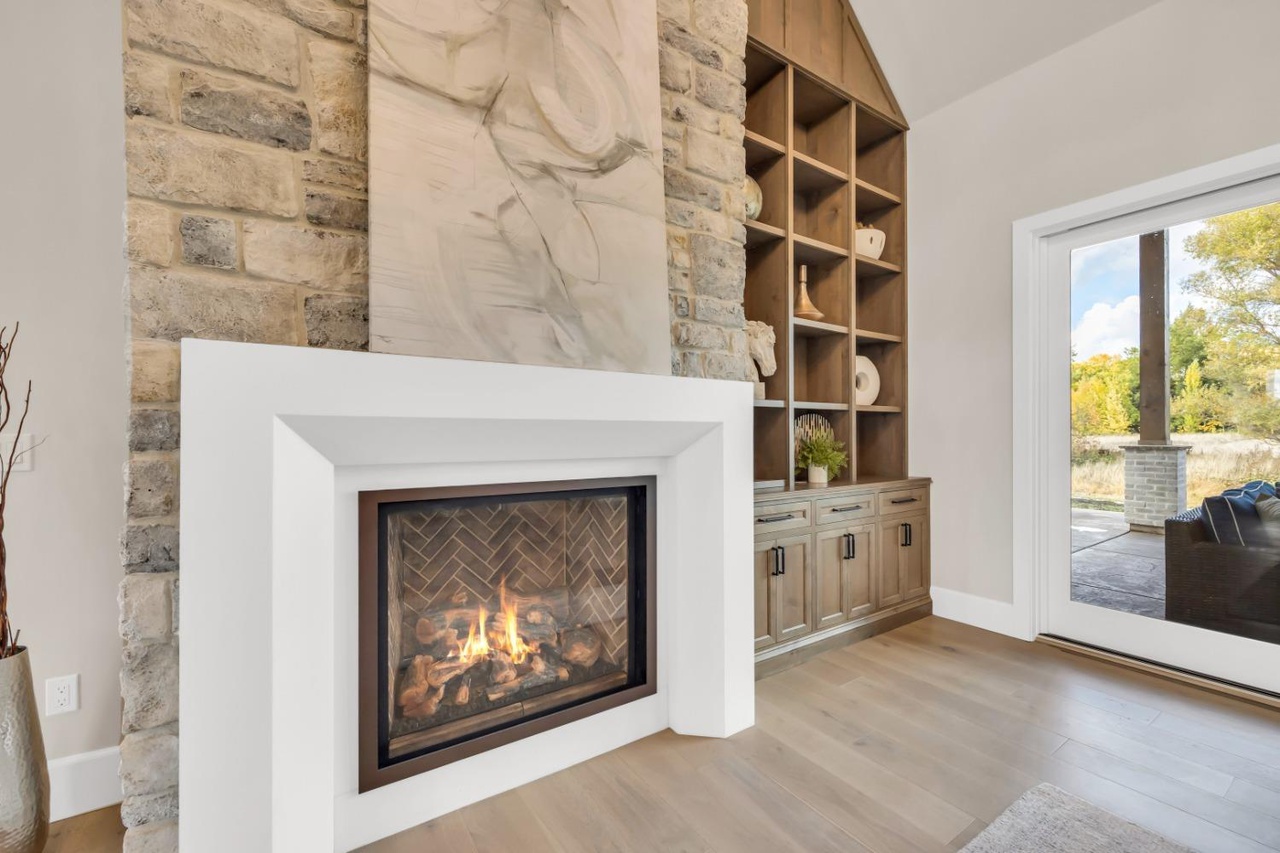 A stone fireplace purchased from Pacific Hearth & Home, Inc. in Rancho Cordova, CA