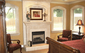 A stone fireplace purchased from Pacific Hearth & Home, Inc. in Rancho Cordova, CA